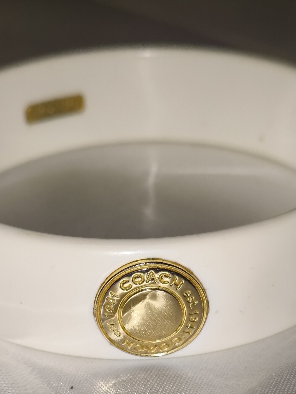 Coach Ivory with Gold Logo Medallions Resin Bracelet